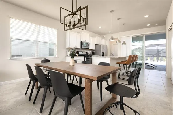a dining room with a table chairs and a dining table