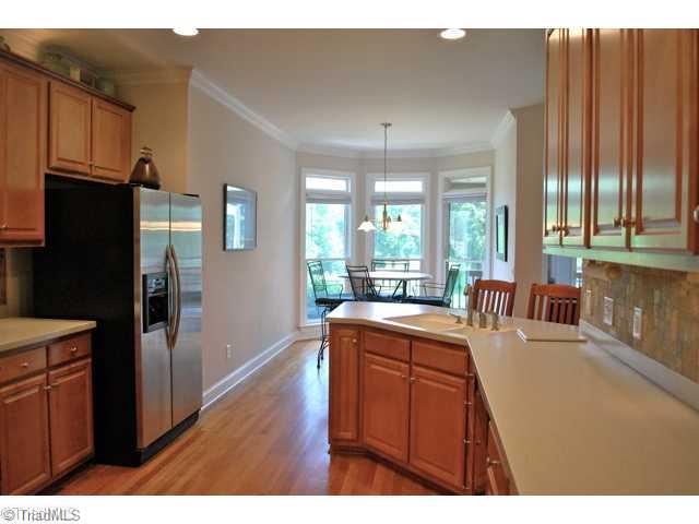 6004 Chalet Drive Oak Ridge, NC 27310 - Photo 3 of 16 Kitchen. Well-designed, this Kitchen features extended counetrtop for additional seating for those casual meals...