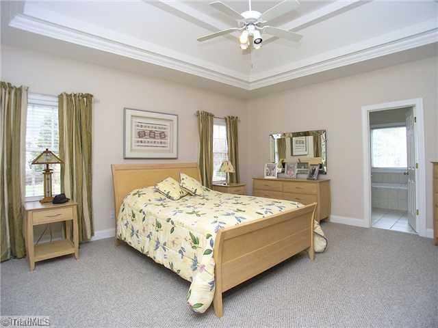 6004 Chalet Drive Oak Ridge, NC 27310 - Photo 10 of 16 Master Bedroom. Elaborate Owner s Suite with double tray ceiling, lots of natural light, private luxury bath.