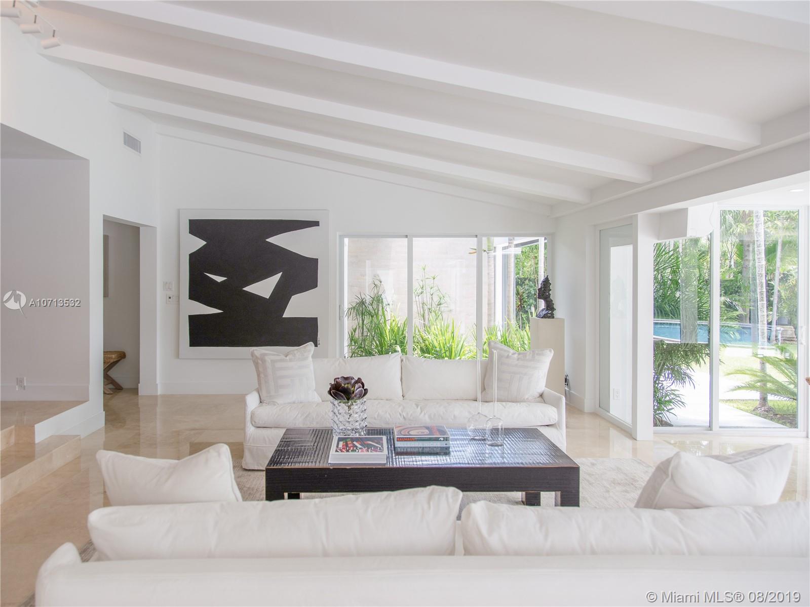 4765 Lake Road Miami, FL 33137 - Photo 11 of 30 a living room with furniture and a large window