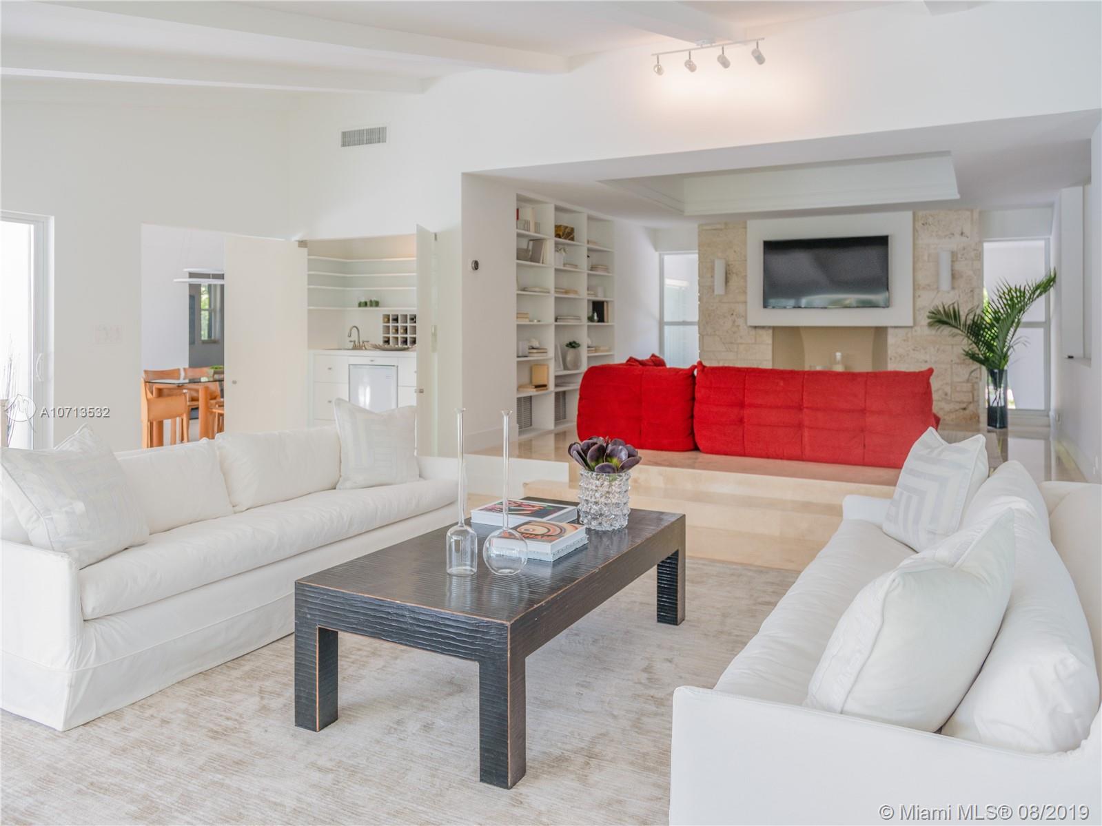4765 Lake Road Miami, FL 33137 - Photo 13 of 30 a living room with furniture and a potted plant