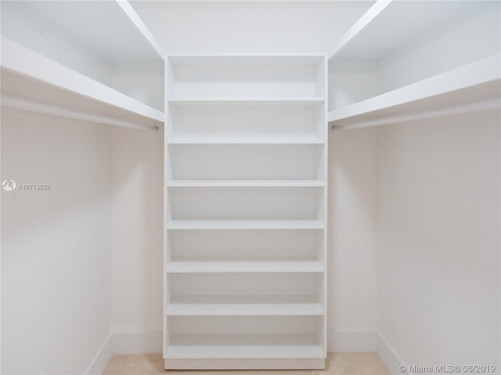 4765 Lake Road Miami, FL 33137 - Photo 26 of 30 a view of an empty walk in closet