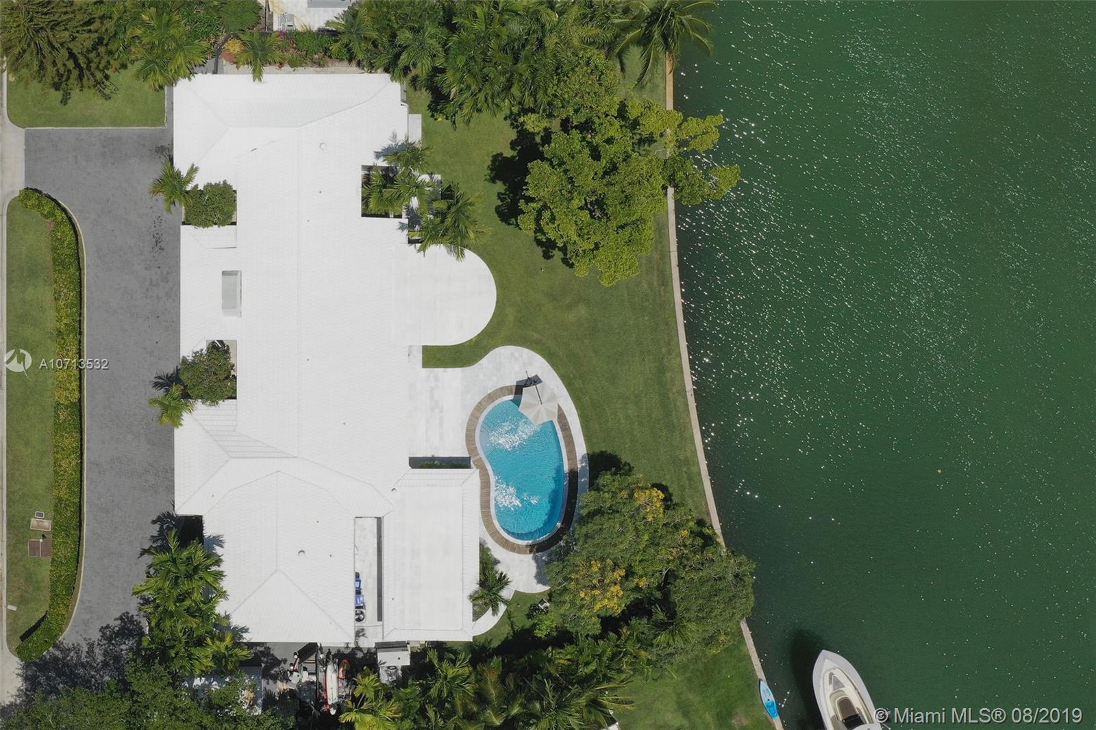 4765 Lake Road Miami, FL 33137 - Photo 7 of 30 an aerial view of a house with garden space and swimming pool