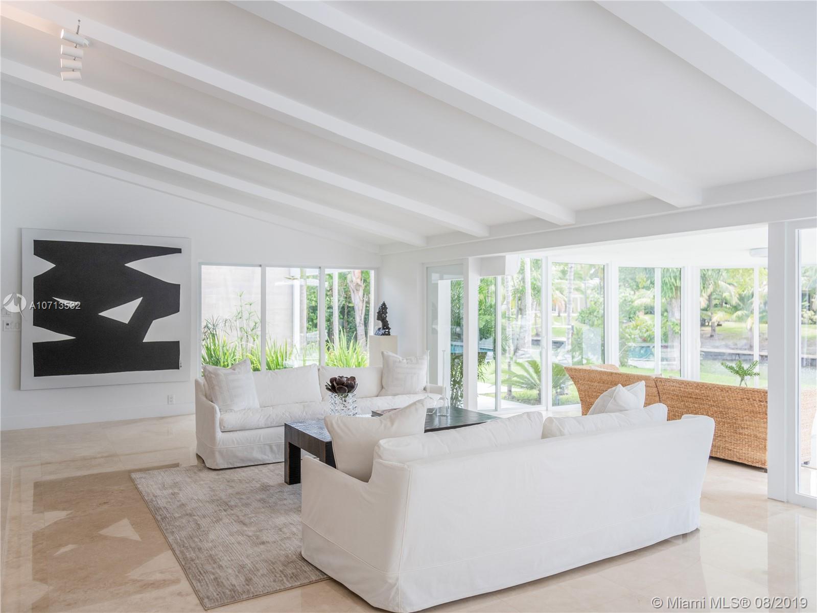 4765 Lake Road Miami, FL 33137 - Photo 10 of 30 a living room with furniture and large windows