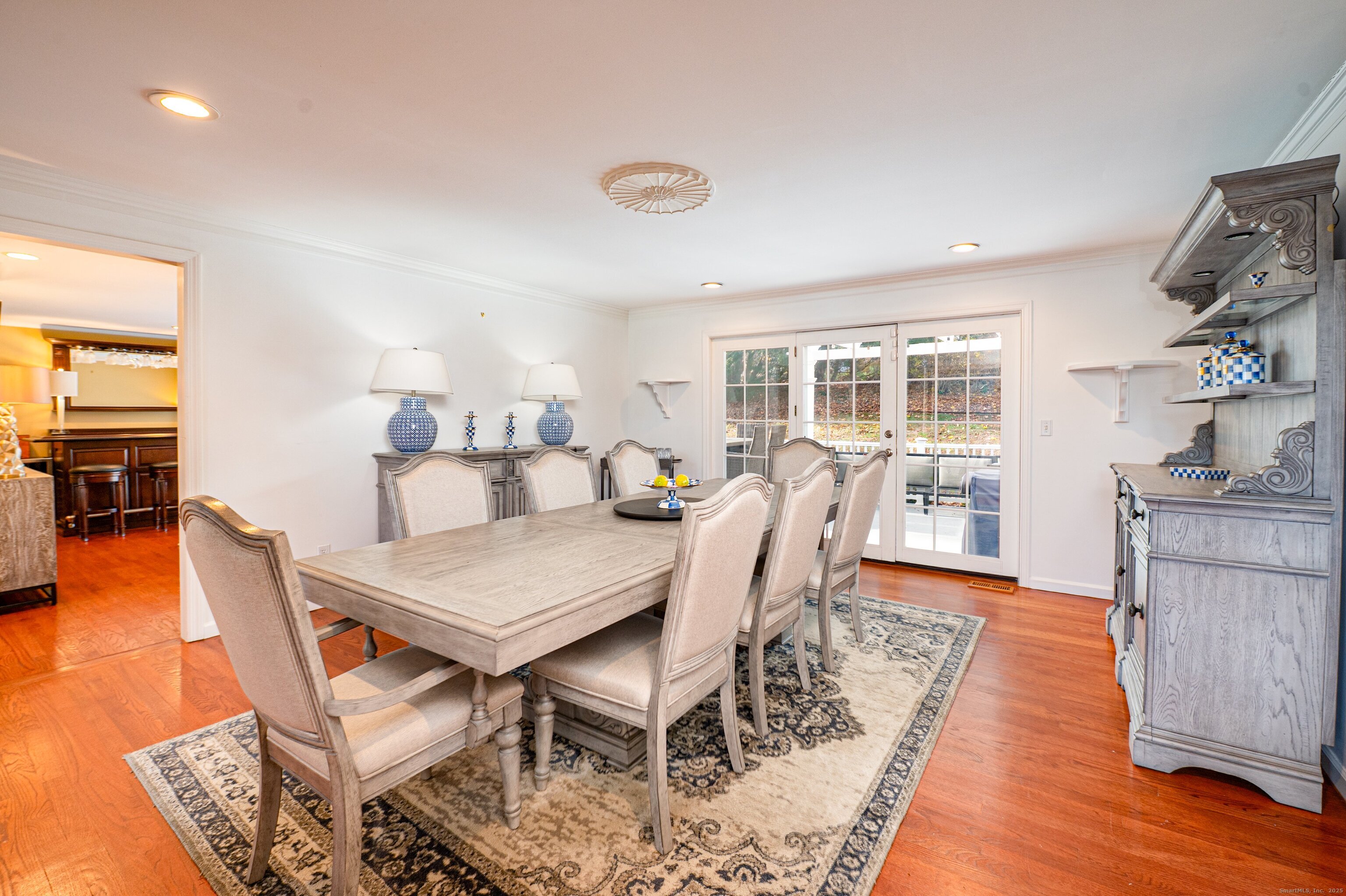 15 Griffing Pond Road Branford, CT 06405 - Photo 15 of 40 a view of a dining room with furniture and wooden floor