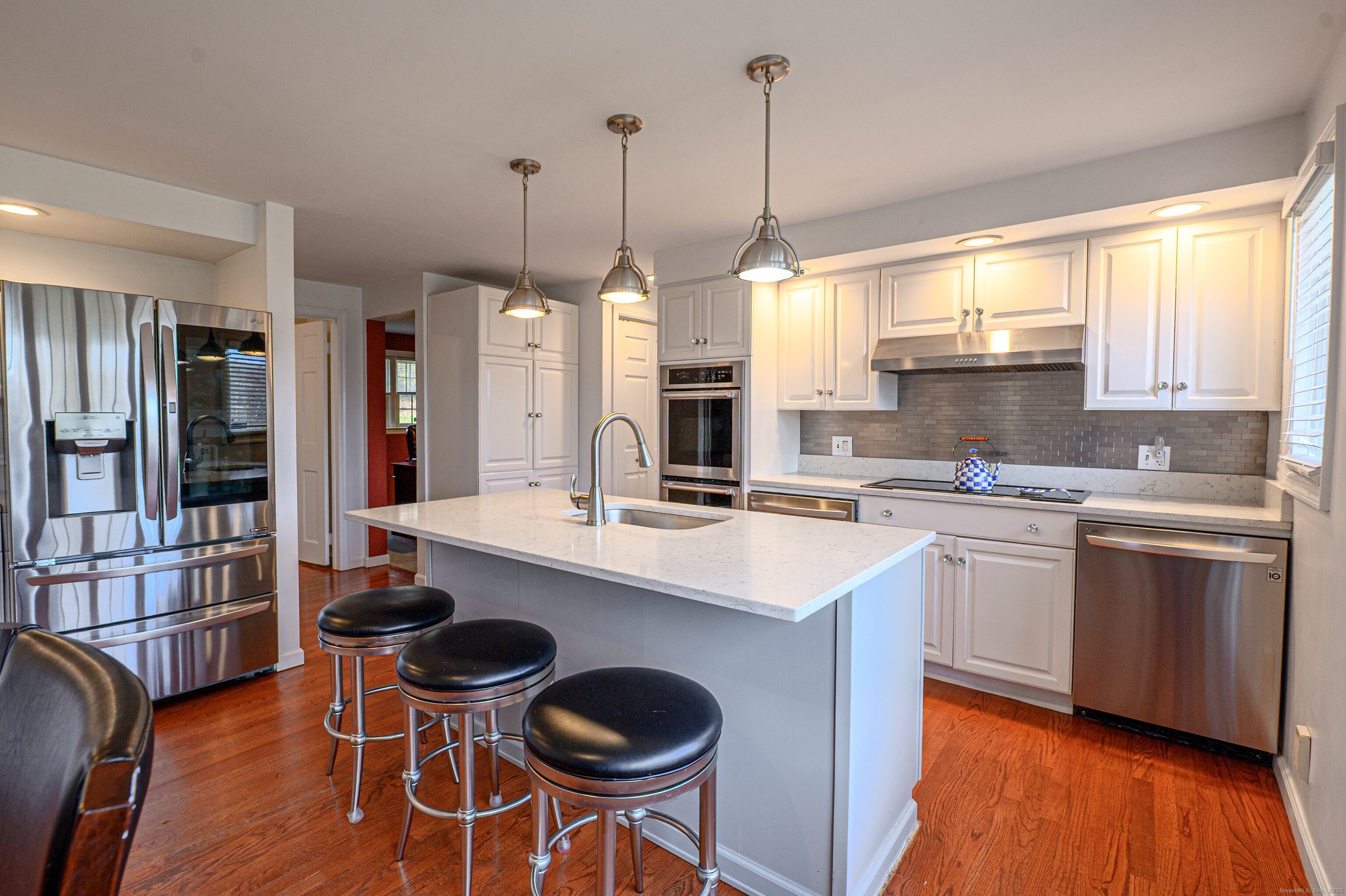 15 Griffing Pond Road Branford, CT 06405 - Photo 23 of 40 a kitchen with appliances a sink and cabinets