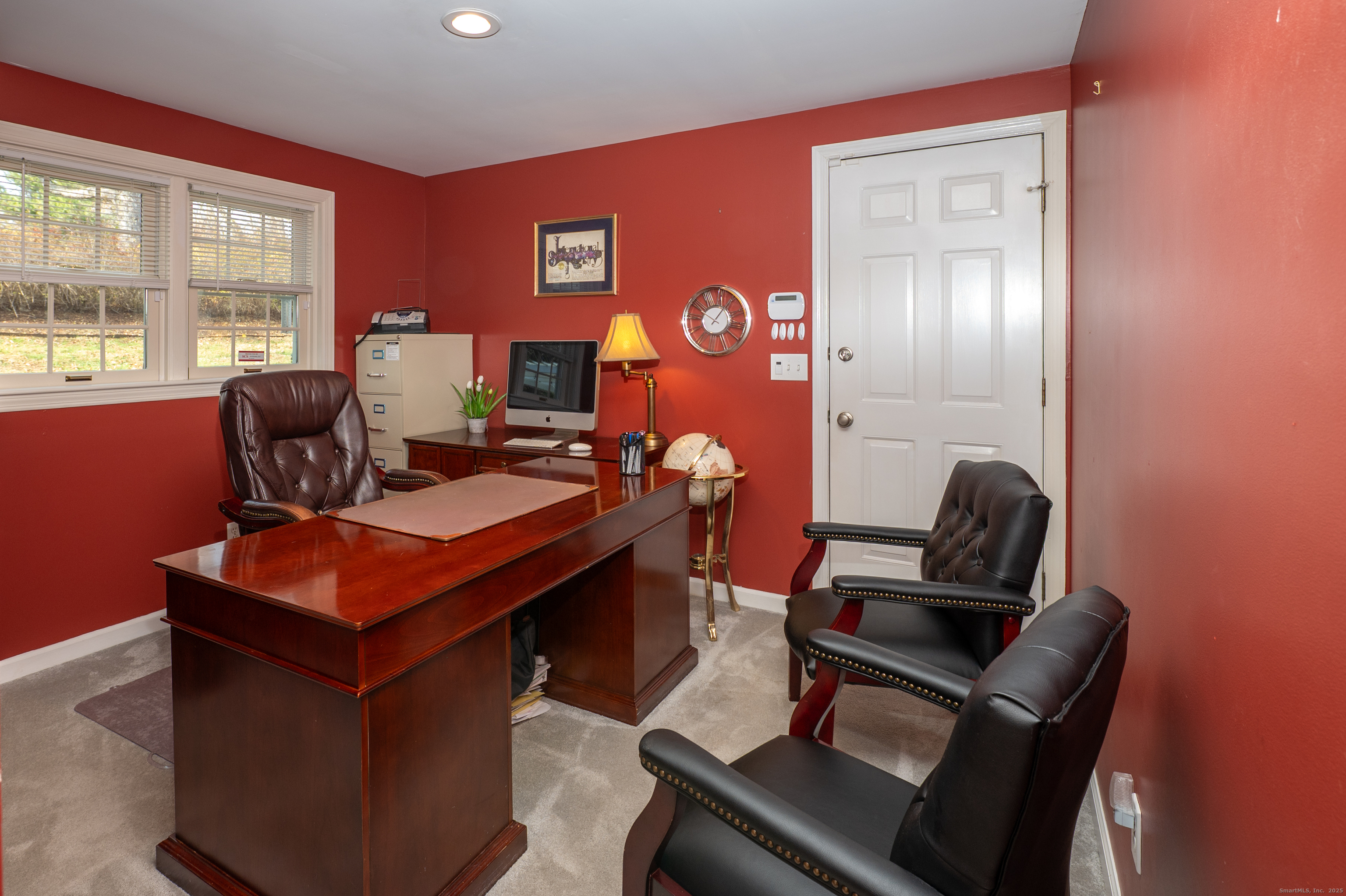 15 Griffing Pond Road Branford, CT 06405 - Photo 24 of 40 a living room with furniture a rug and a window