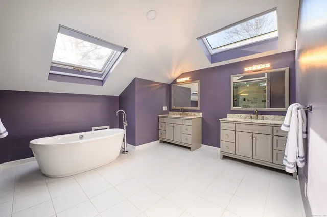 a room with a chair and dresser