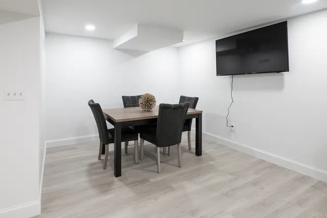 a white toilet sitting next to a bathroom sink