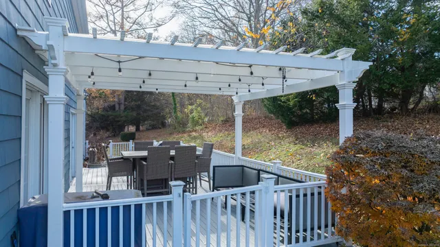 a view of a patio with table and chairs and potted plants