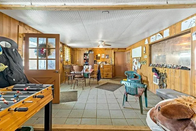 a living room with furniture a rug and a window