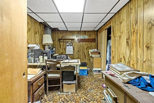 a very nice looking room with a large window and furniture