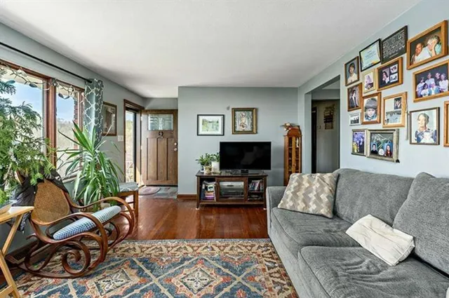 a living room with furniture or couch and a flat screen tv
