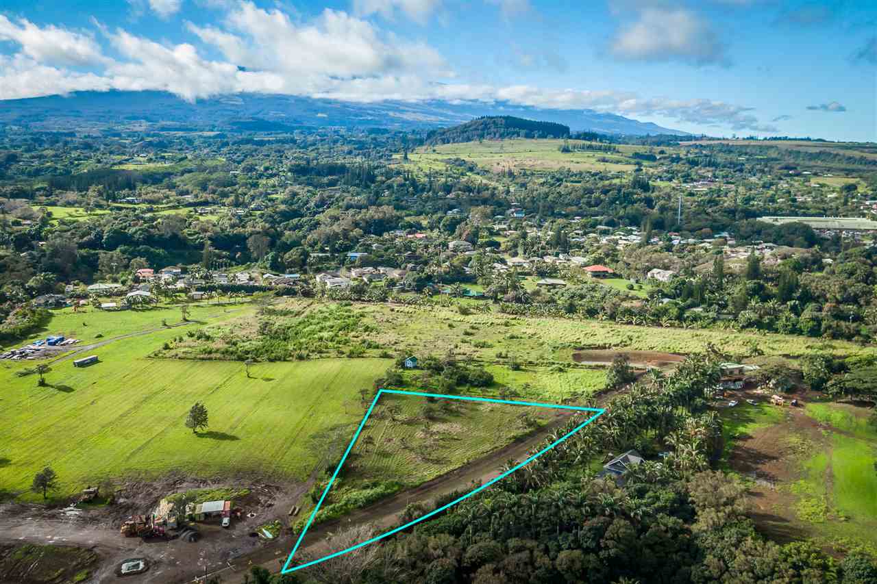 653 Kauhikoa Road, Unit A Haiku, HI 96708 - Photo 2 of 28 a view of a lake with a city
