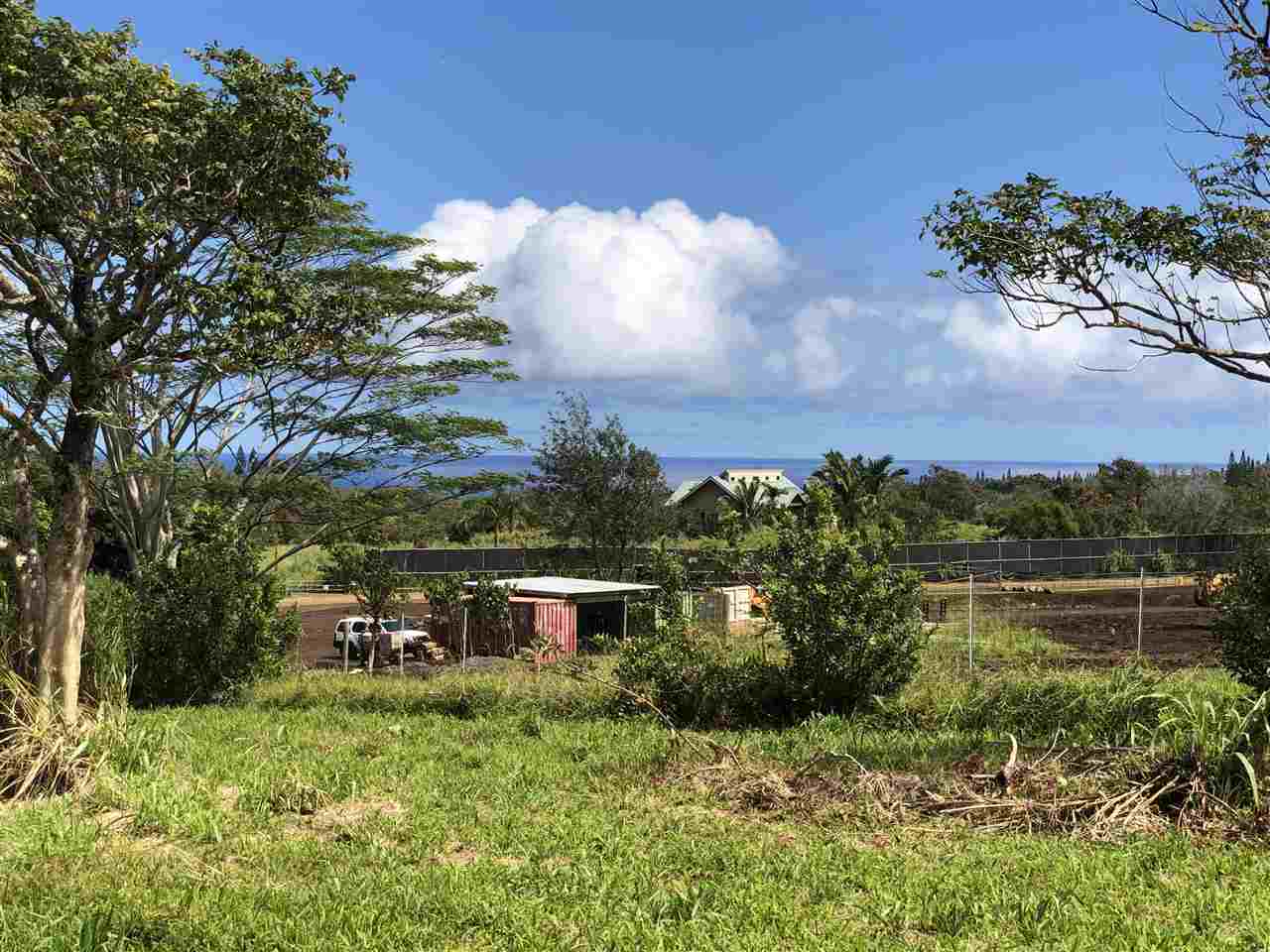 653 Kauhikoa Road, Unit A Haiku, HI 96708 - Photo 8 of 28 a view of a lake with a house in the background