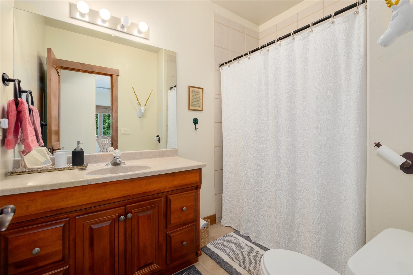 592 Ponderosa Road Fairplay, CO 80440 - Photo 34 of 45 a bathroom with a double vanity sink mirror and toilet