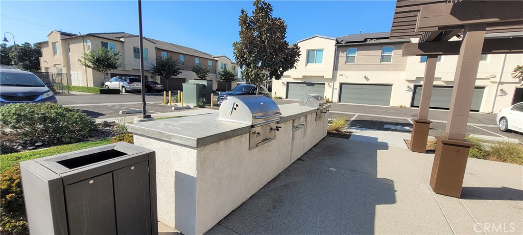 45 Aria Street South El Monte, CA 91733 - Photo 12 of 12 a kitchen with stainless steel appliances granite countertop a stove a sink and a refrigerator