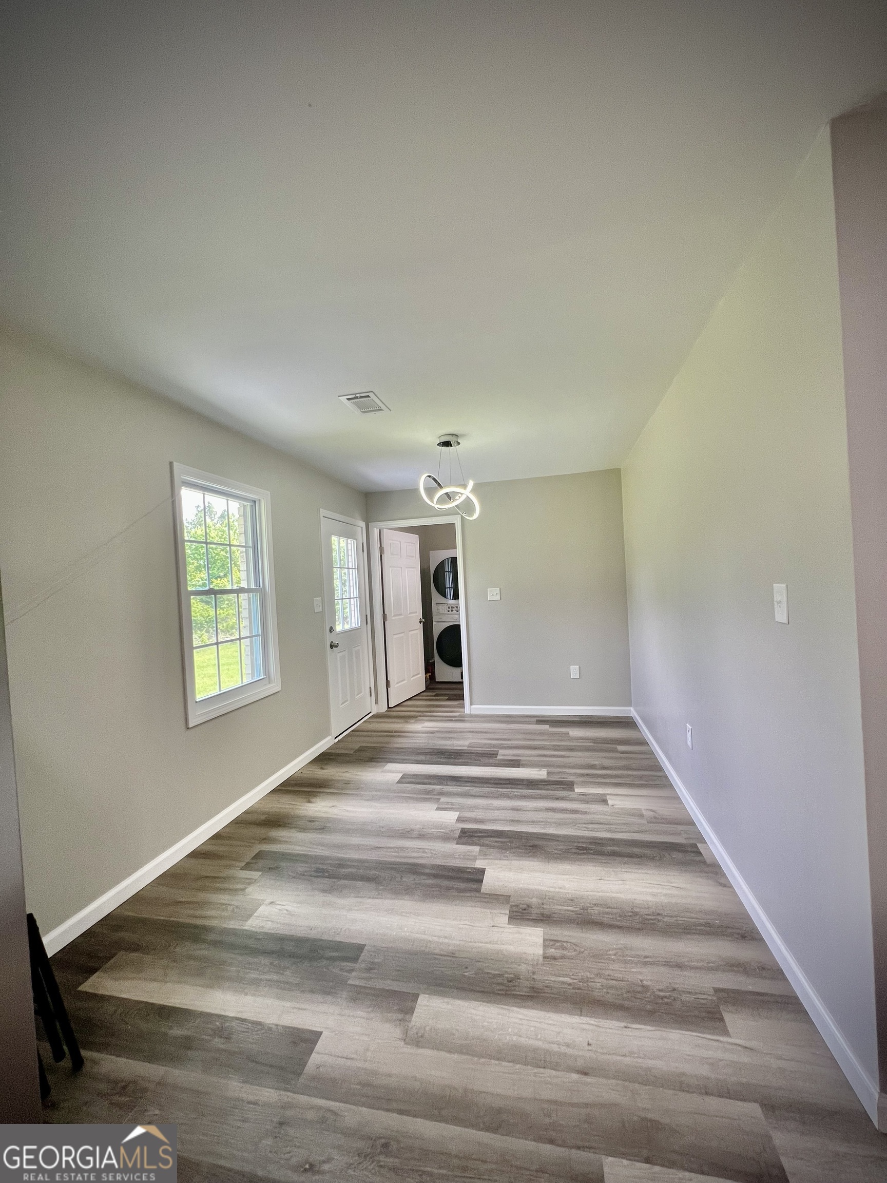 1962 Anderson Road Rentz, GA 31075 - Photo 12 of 26 a view of empty room with wooden floor and fan
