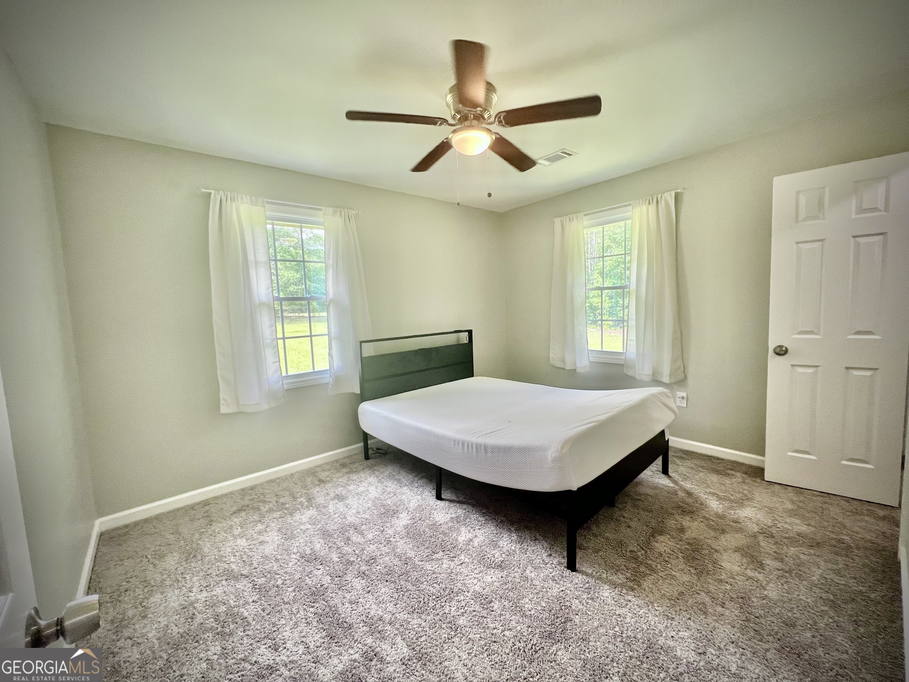 1962 Anderson Road Rentz, GA 31075 - Photo 16 of 26 a bedroom with a bed and a window