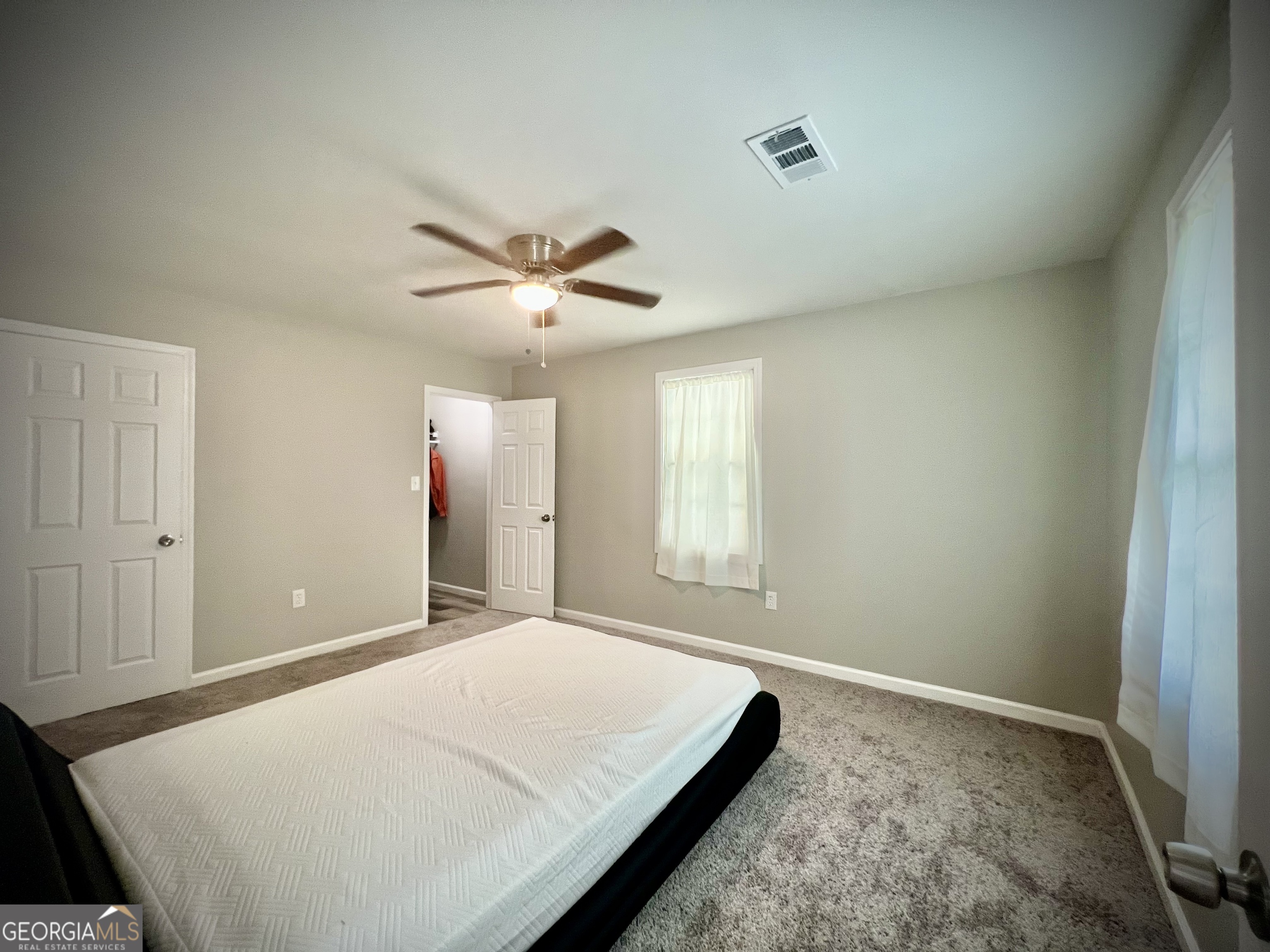 1962 Anderson Road Rentz, GA 31075 - Photo 19 of 26 a bed room with a bed and a window