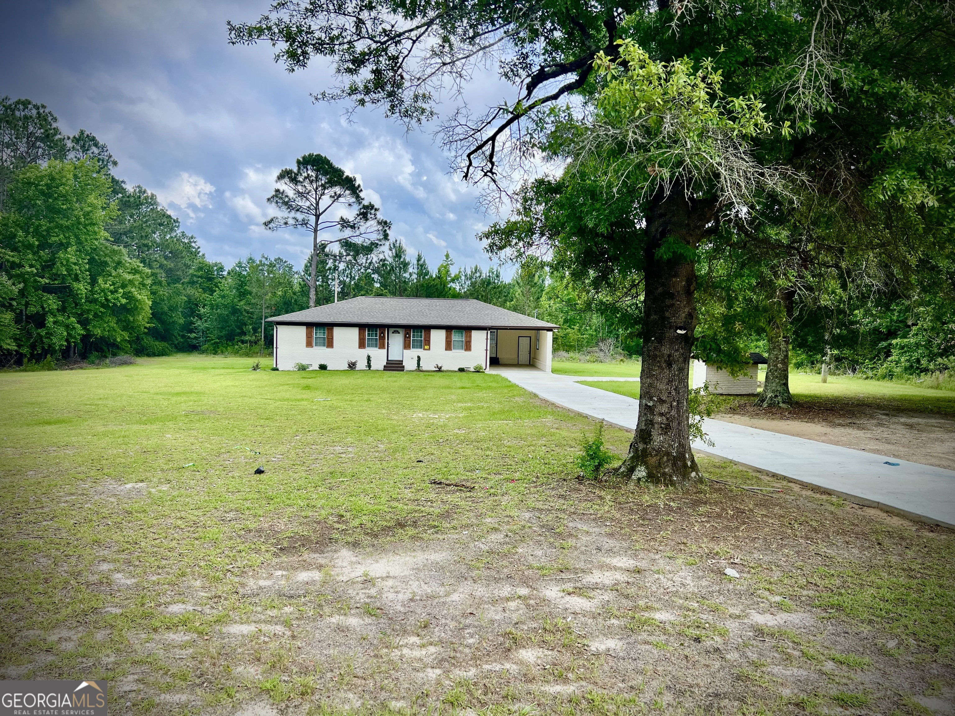 1962 Anderson Road Rentz, GA 31075 - Photo 25 of 26 a view of a house with a yard