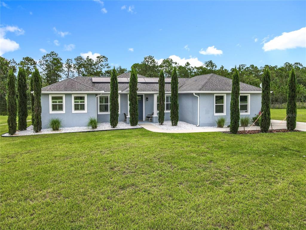 10220 Bay Lake Road Groveland, FL 34736 - Photo 47 of 67 front view of a house with a yard