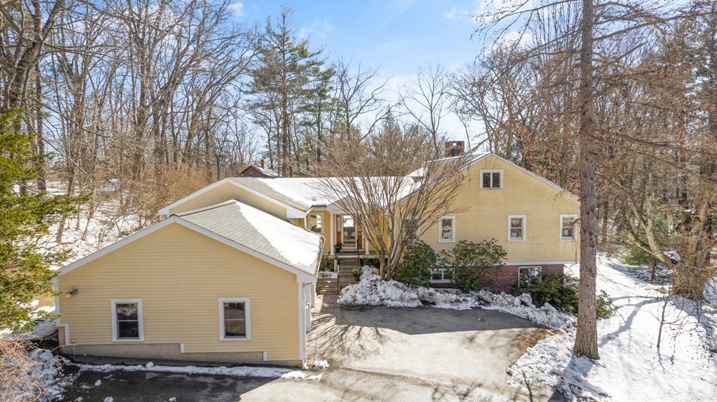 410 Lowell Road Concord, MA 01742 - Photo 1 of 36 a view of a house with a yard