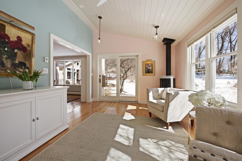 410 Lowell Road Concord, MA 01742 - Photo 11 of 36 a living room with furniture and a large window