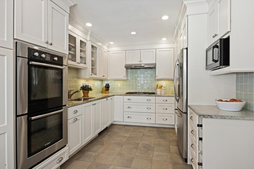 410 Lowell Road Concord, MA 01742 - Photo 13 of 36 a kitchen with granite countertop cabinets and steel stainless steel appliances