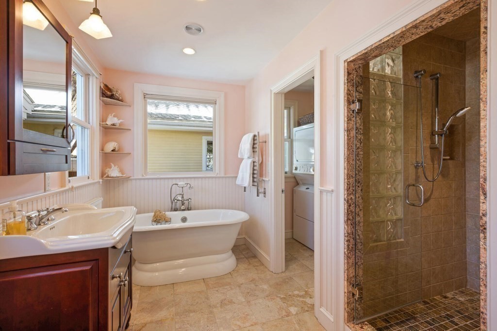 410 Lowell Road Concord, MA 01742 - Photo 18 of 36 a bathroom with a bathtub shower sink mirror and toilet