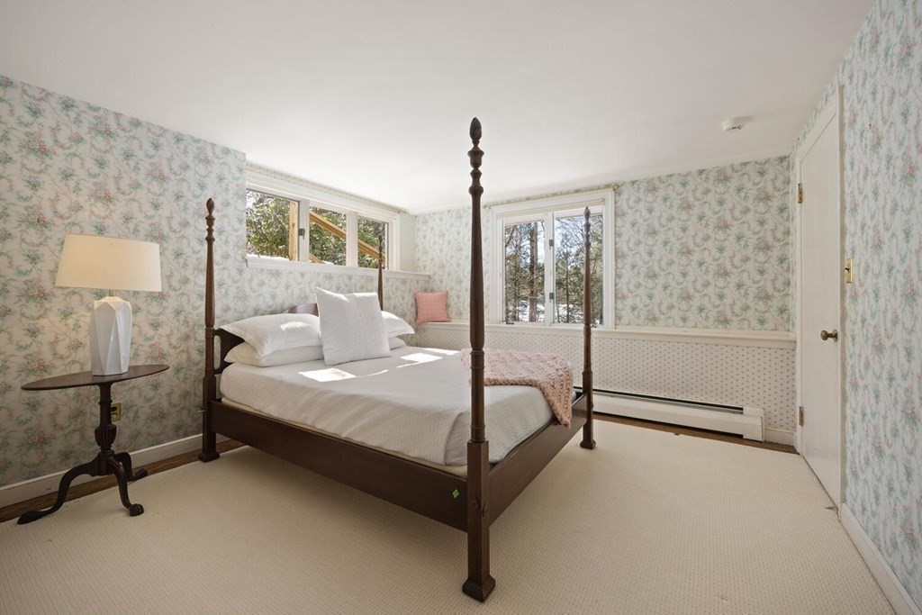 410 Lowell Road Concord, MA 01742 - Photo 24 of 36 a spacious bedroom with a bed and a window