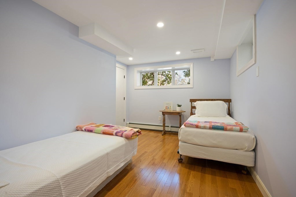 410 Lowell Road Concord, MA 01742 - Photo 25 of 36 a bedroom with a bed and a couch