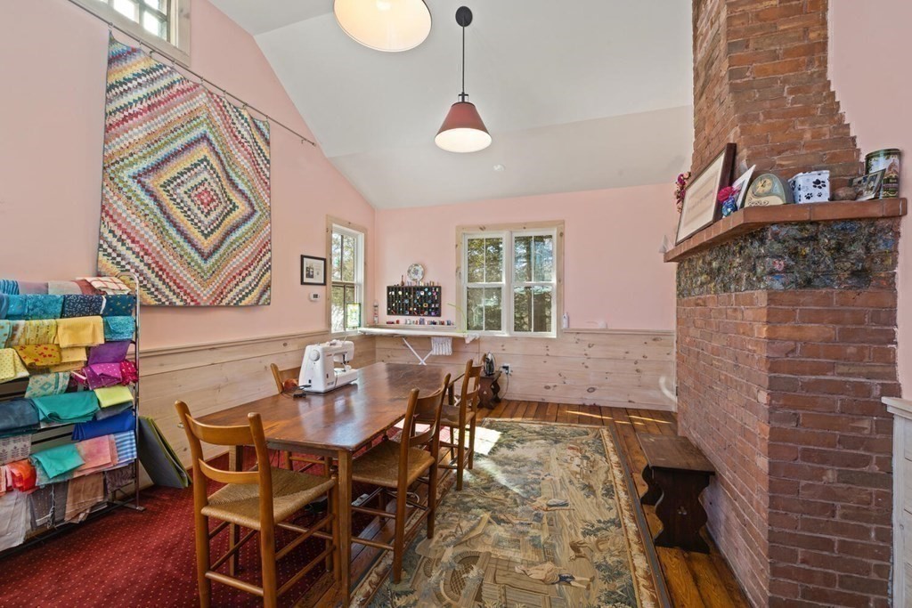 410 Lowell Road Concord, MA 01742 - Photo 28 of 36 a dining room with furniture and wooden floor