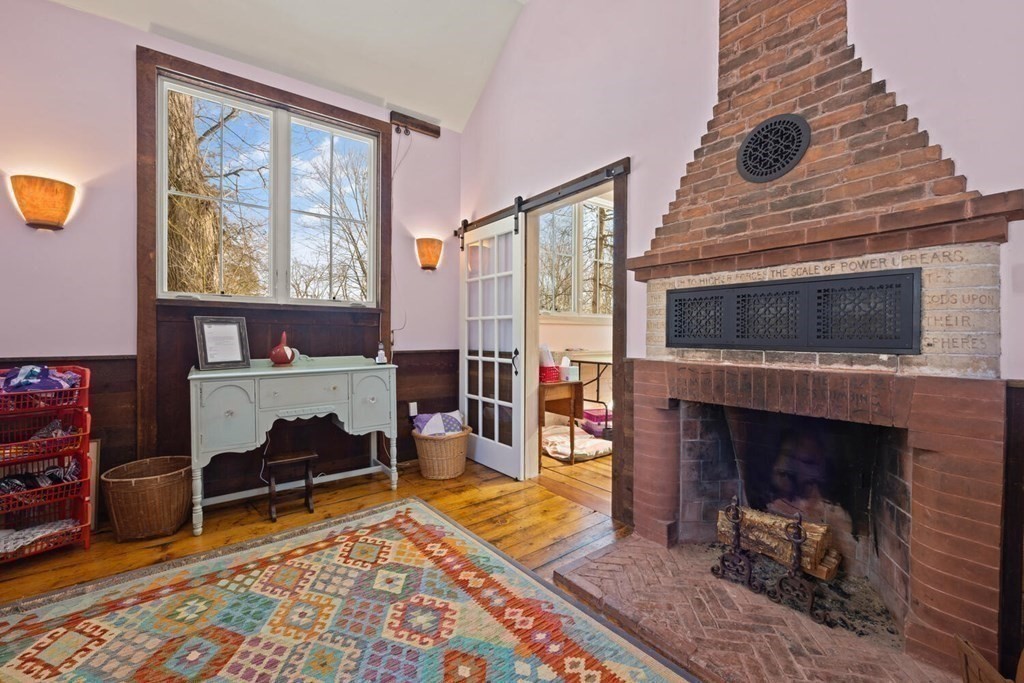 410 Lowell Road Concord, MA 01742 - Photo 29 of 36 a living room with furniture and a fireplace