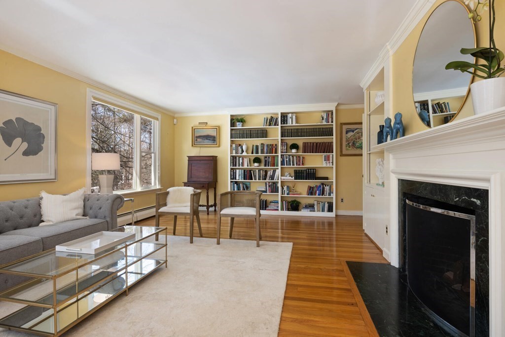 410 Lowell Road Concord, MA 01742 - Photo 5 of 36 a living room with furniture and a fireplace