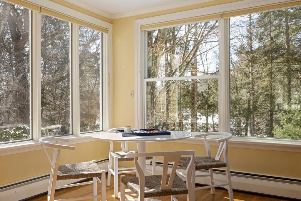 410 Lowell Road Concord, MA 01742 - Photo 6 of 36 a dining room with furniture and large windows