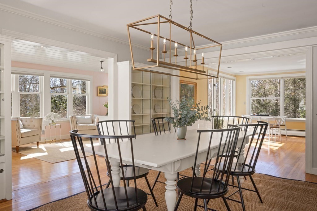 410 Lowell Road Concord, MA 01742 - Photo 8 of 36 a view of a dining room with furniture window and wooden floor