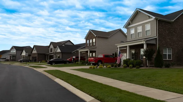 a view of multiple houses with a yard