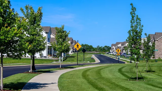 an aerial view of a house with yard