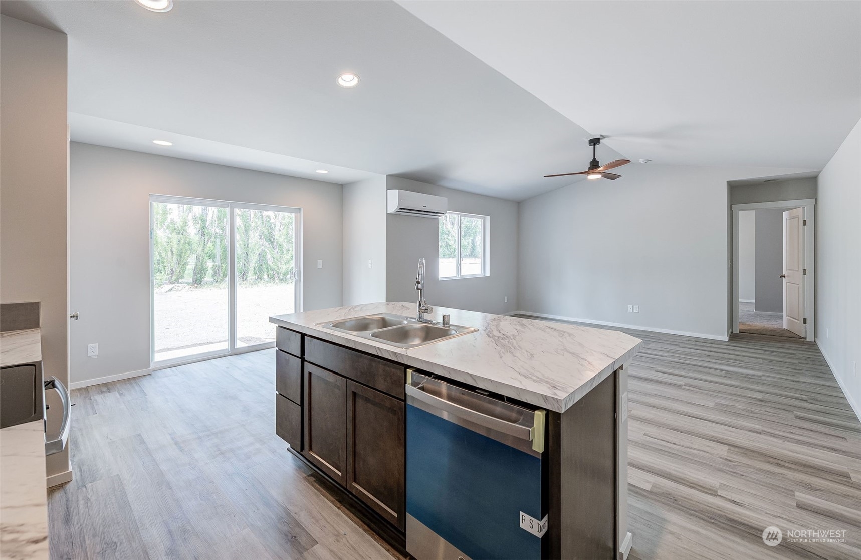 101 Walnut Street Tieton, WA 98947 - Photo 12 of 27 a kitchen with a stove and wooden floor