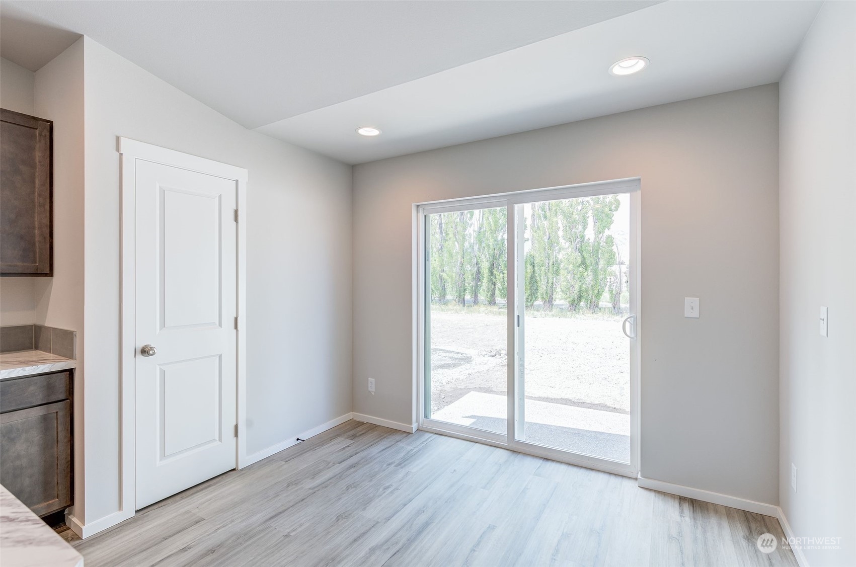 101 Walnut Street Tieton, WA 98947 - Photo 13 of 27 a view of an empty room with wooden floor and a window