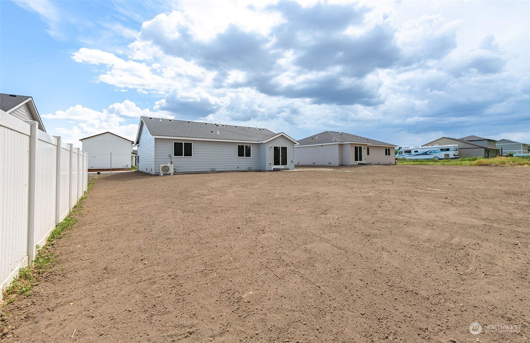 101 Walnut Street Tieton, WA 98947 - Photo 24 of 27 a view of a house with a big yard and large trees