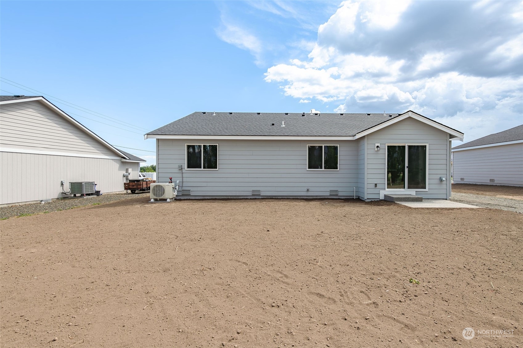 101 Walnut Street Tieton, WA 98947 - Photo 25 of 27 a front view of a house with a yard and garage