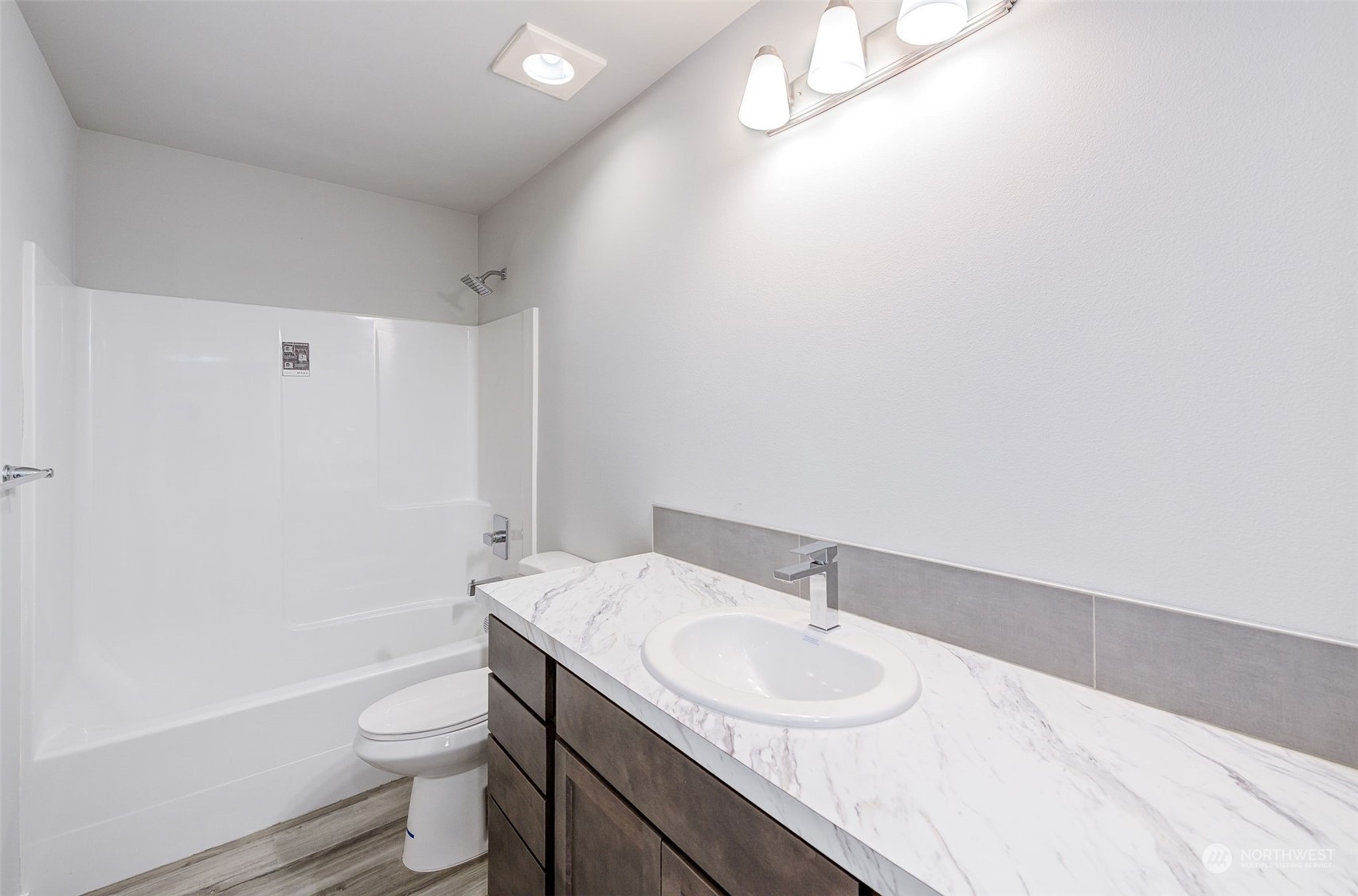 101 Walnut Street Tieton, WA 98947 - Photo 4 of 27 a bathroom with a sink toilet vanity and shower