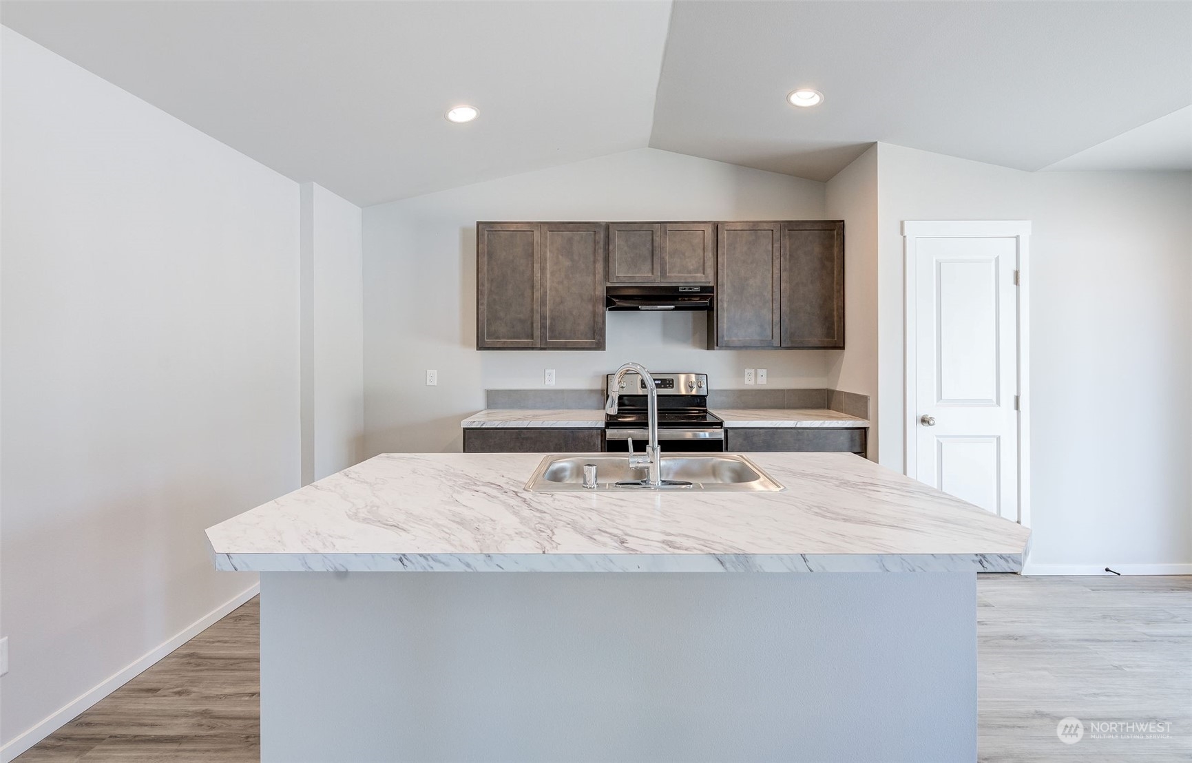101 Walnut Street Tieton, WA 98947 - Photo 9 of 27 a kitchen with a stove a refrigerator and a sink