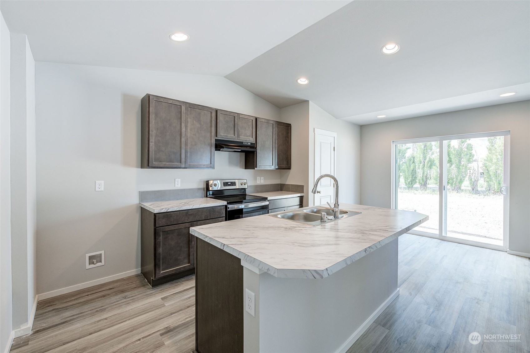 101 Walnut Street Tieton, WA 98947 - Photo 10 of 27 a kitchen with sink a microwave and cabinets