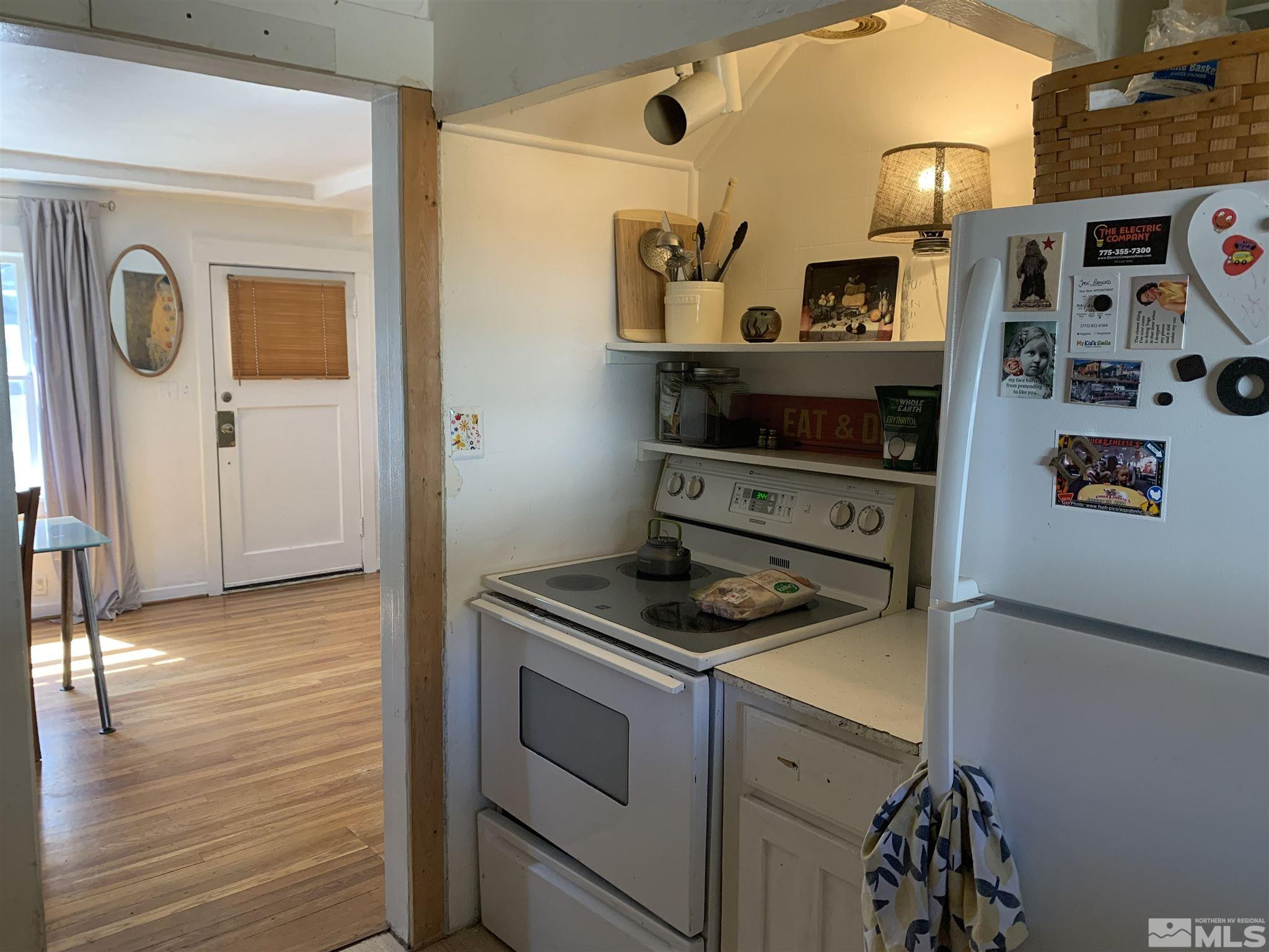 1230 Watt Street Reno, NV 89509 - Photo 14 of 18 a kitchen with stainless steel appliances granite countertop a stove and cabinets