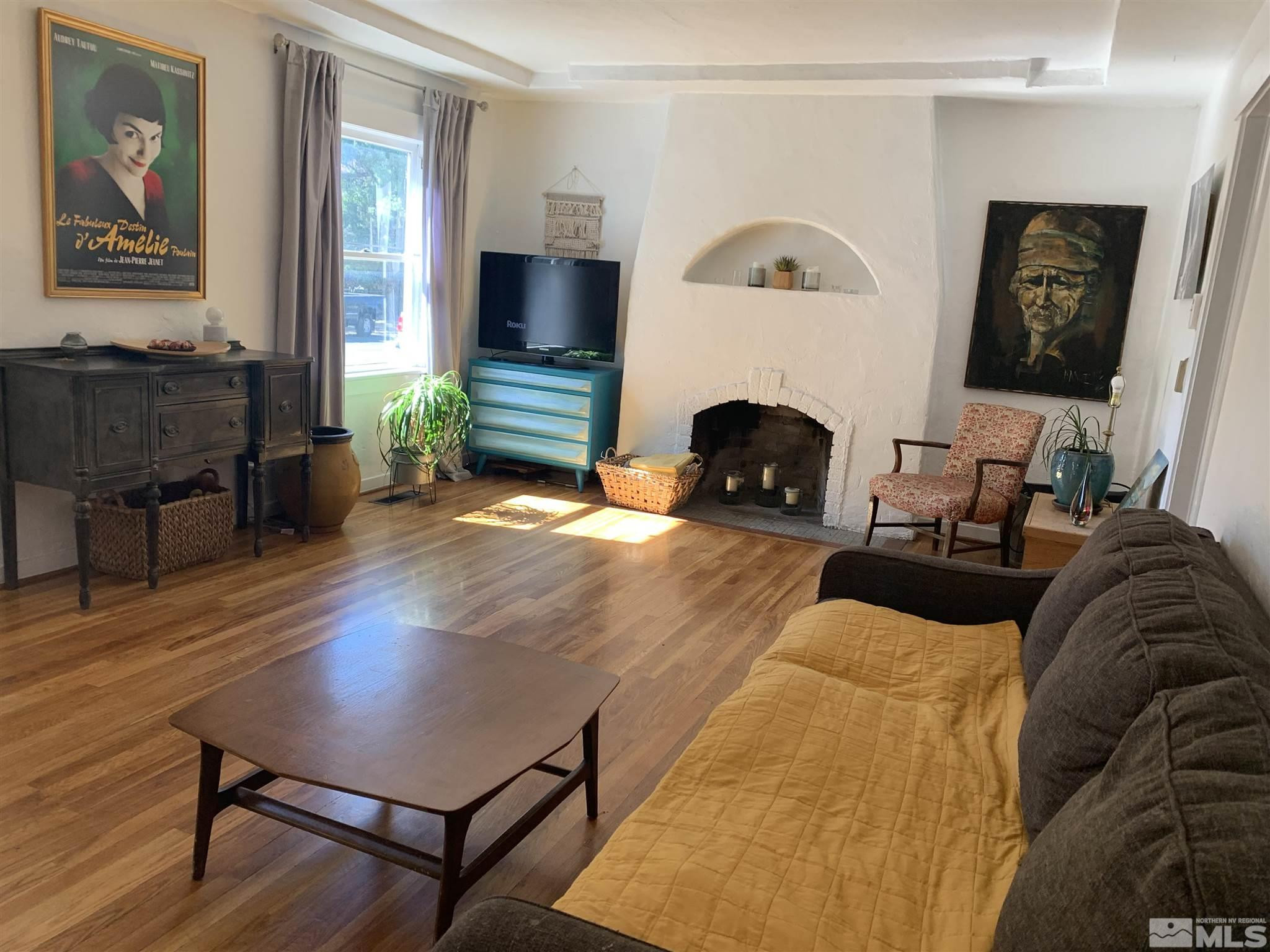 1230 Watt Street Reno, NV 89509 - Photo 2 of 18 a living room with furniture and a fireplace