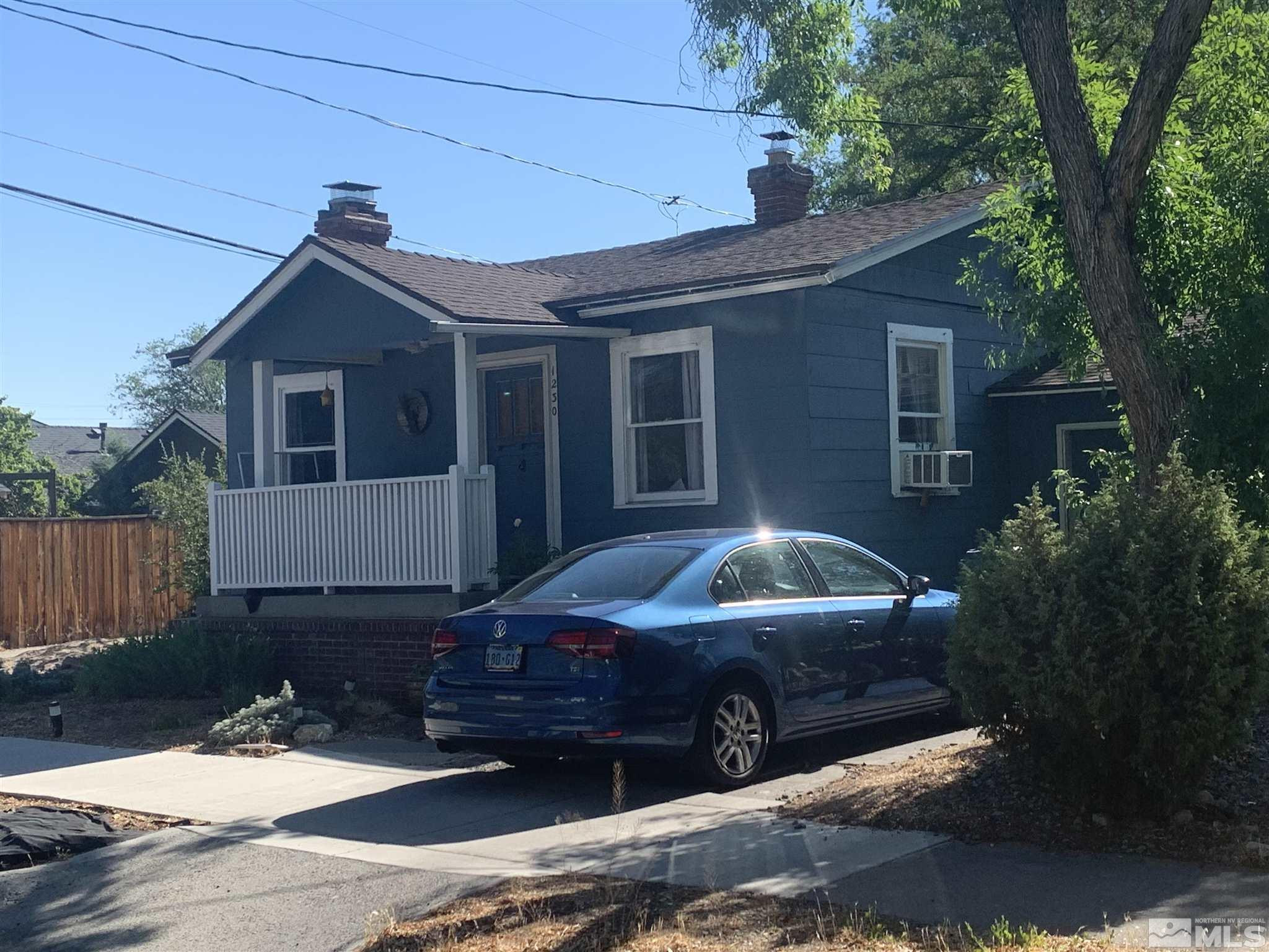 1230 Watt Street Reno, NV 89509 - Photo 3 of 18 a front view of a house with a garden