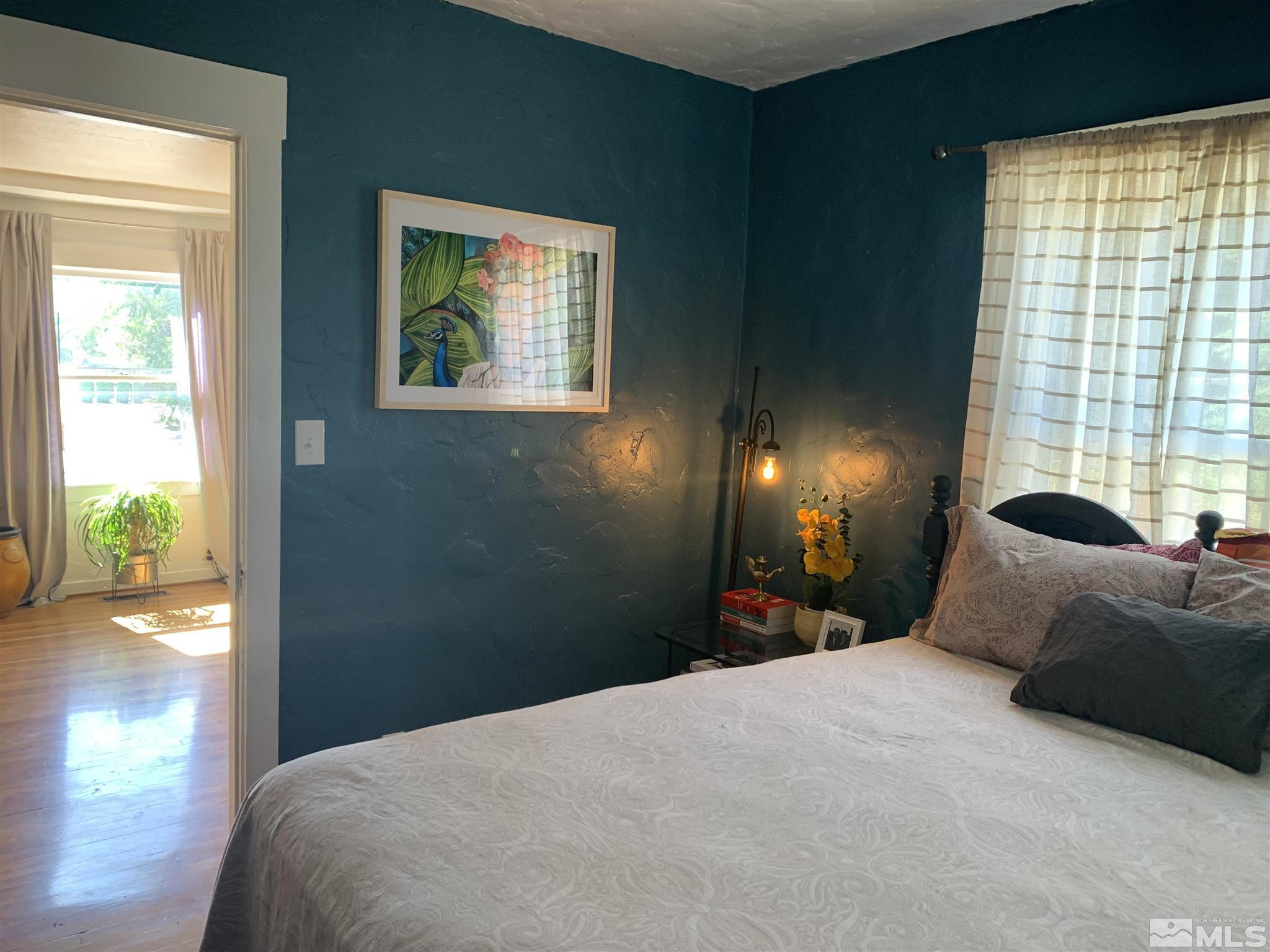 1230 Watt Street Reno, NV 89509 - Photo 9 of 18 a bedroom with a bed and glass window
